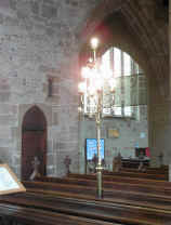 One of the many brass stand lamps created for Holy Trinity by Skidmore